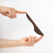 Wooden knife on a white background