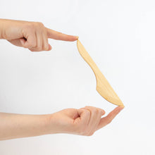 Wooden knife on a white background